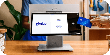 A person using a POS system to make a purchase using tap-to-pay.