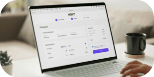 An image of a laptop displaying a checkout screen where an online payment is being made.
