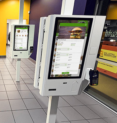 An image of a freestanding mountable point of sale displaying ordering and nutritional information for a burger.