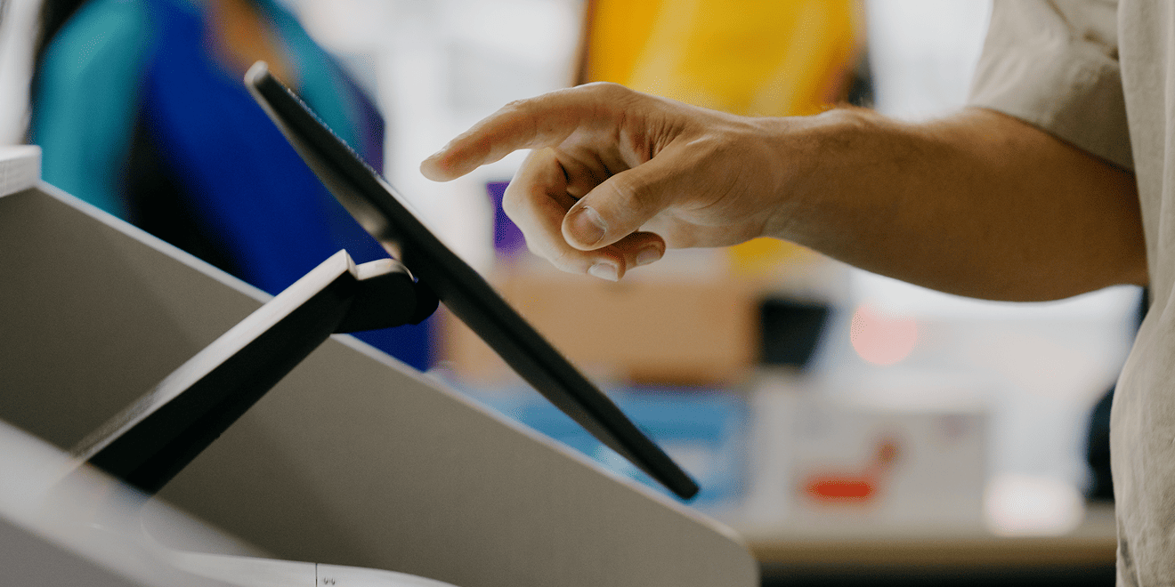 Customer using POS touchscreen
