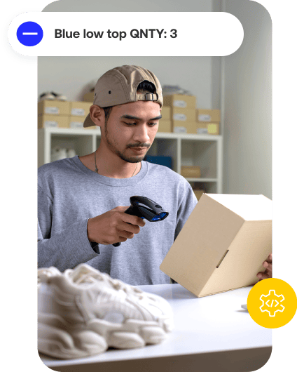 Employee scanning inventory package
