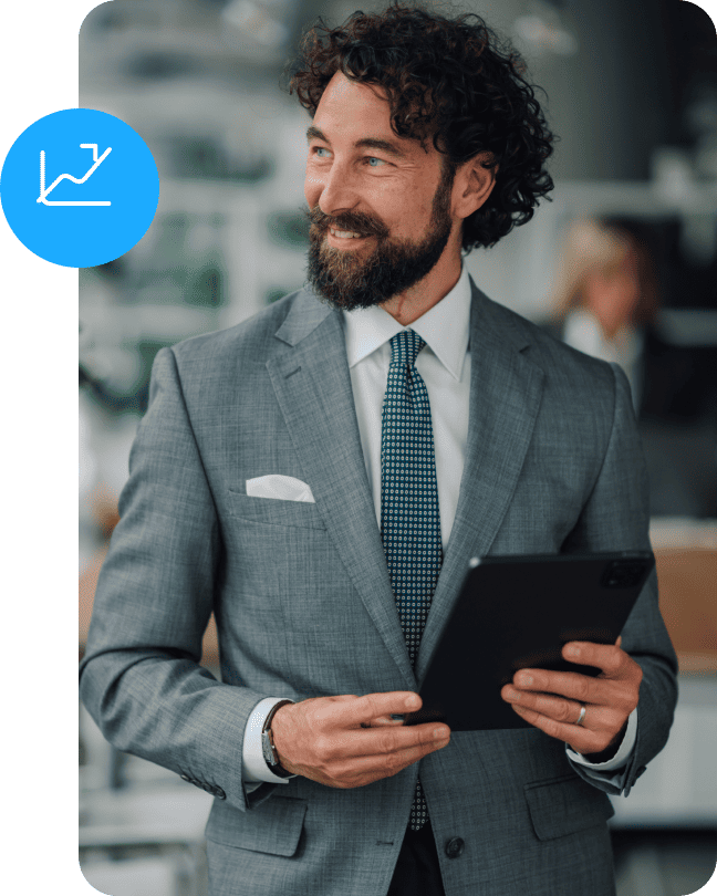 Professional man in a suit holding a tablet with a growth icon badge.