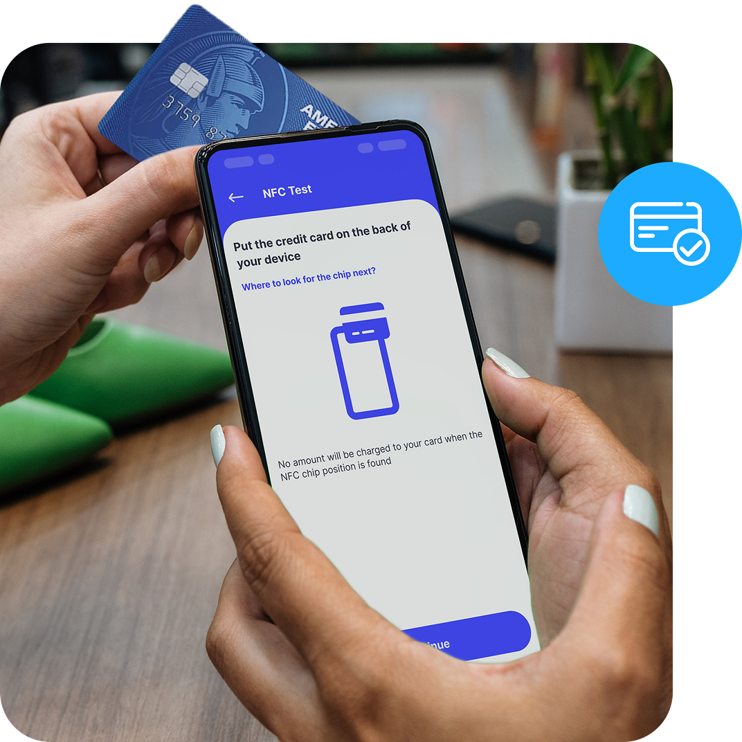 A close up of a chip card tapping a smart phone screen that shows the setup for tap to pay.
