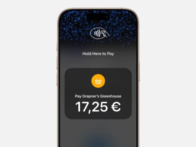 Close up of phone with details of contactless payment on screen